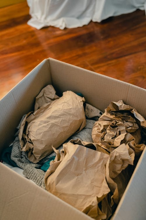 Box-With-Objects-Wrapped-In-Brown-Paper